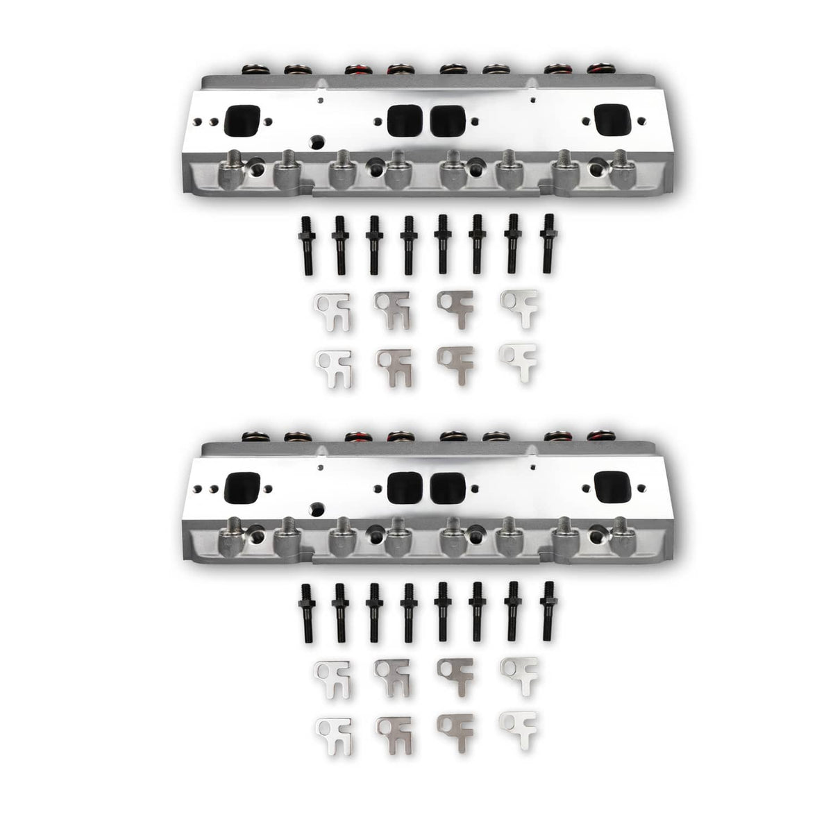Two aluminum cylinder heads with valve train, plus hardware pieces arranged below