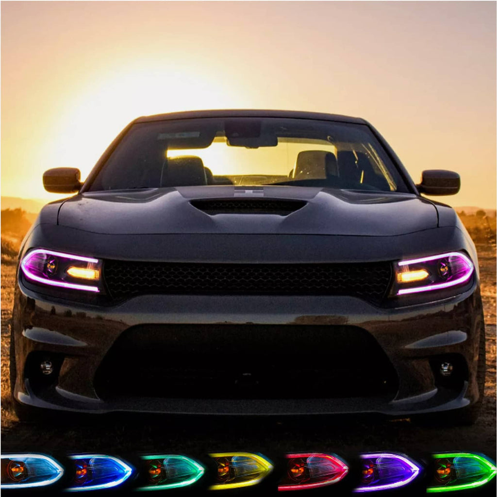 RGB LED projector headlights pair on a dark car with purple LED strip highlights