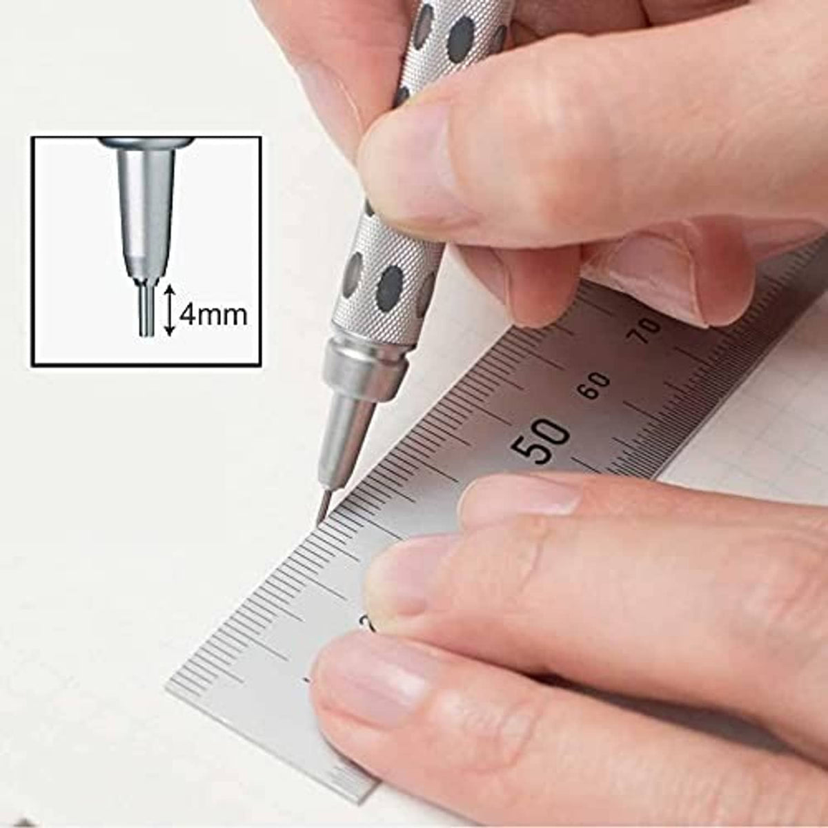 Mechanical pencil lead point writing against a ruler, with small tip extension