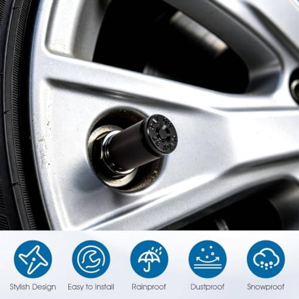 Black valve stem cap on a wheel rim valve, with aluminum shell cap detail