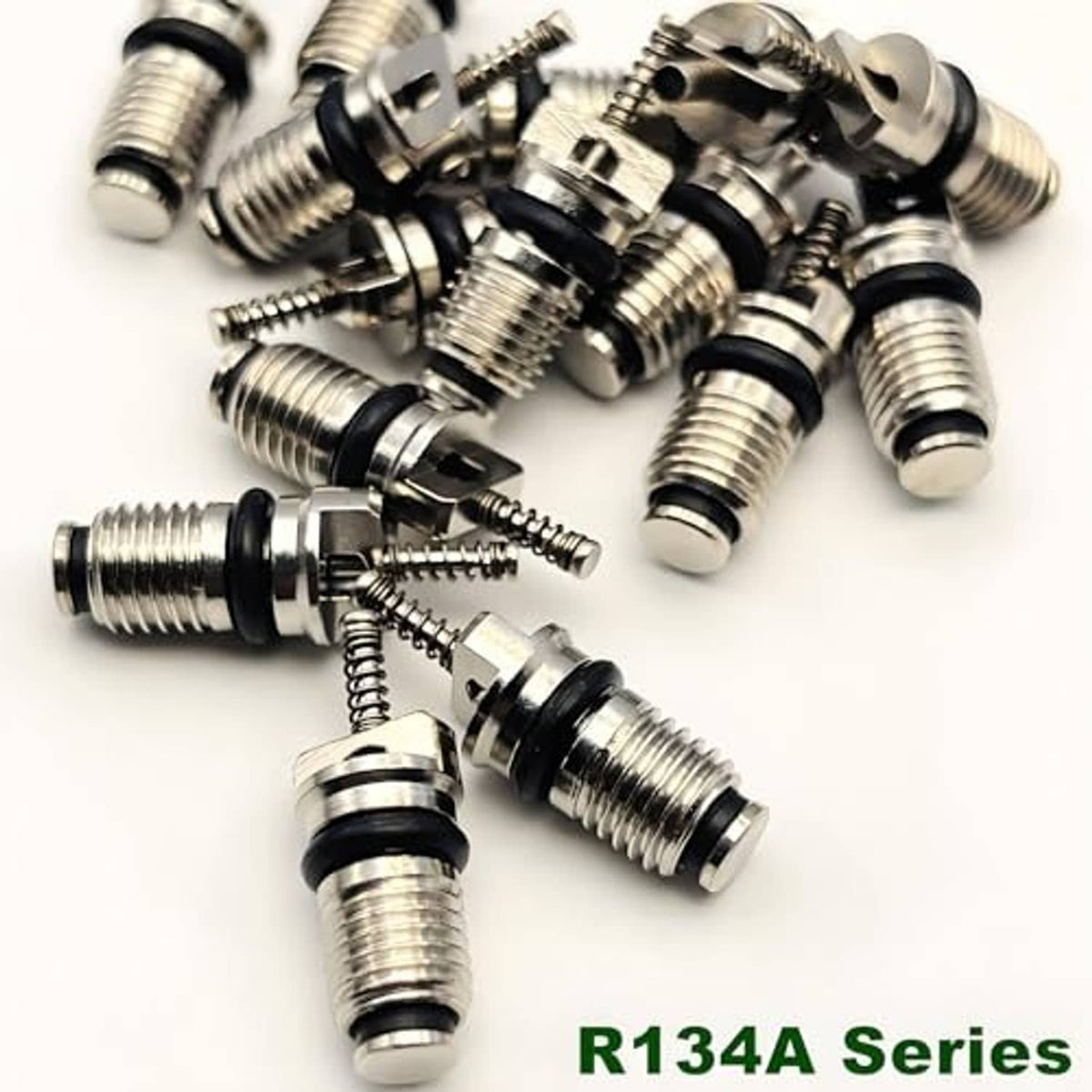 Assorted metal Schrader valve cores with black rubber seals