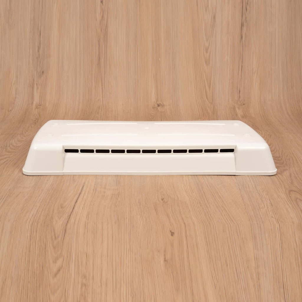 White refrigerator vent cover with long rectangular louvered air slots