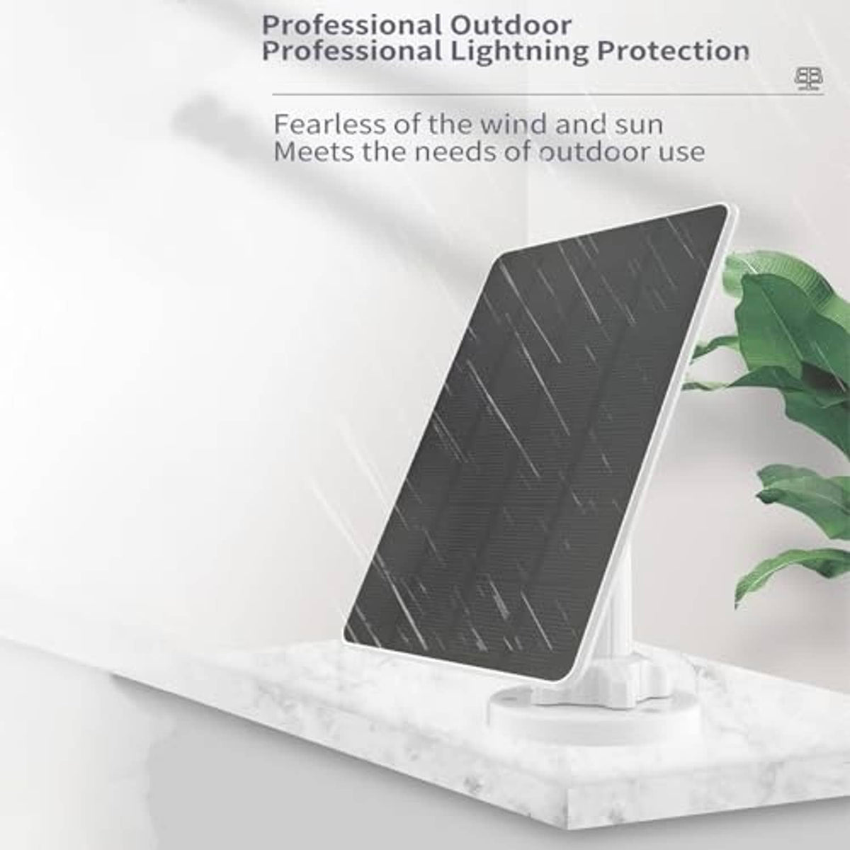 Solar panel charger on white stand with dark grid surface and green leaves