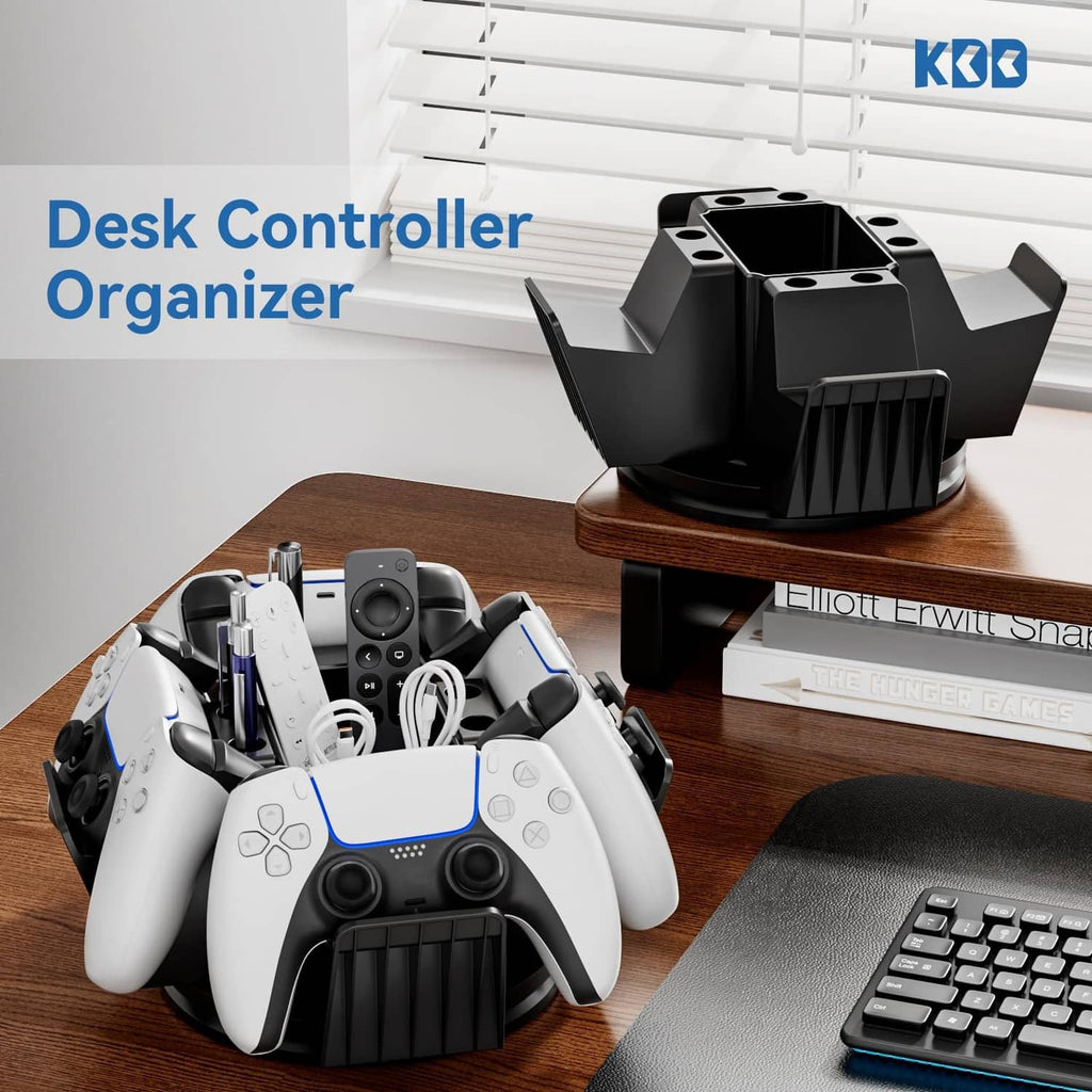 Black desktop controller organizer with stacked controller bays and pen holders on wood desk
