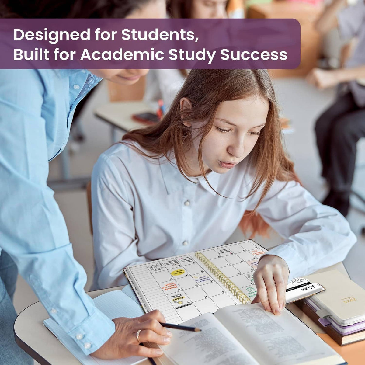 Student writing in spiral academic planner on desk with schedule grid and tabs
