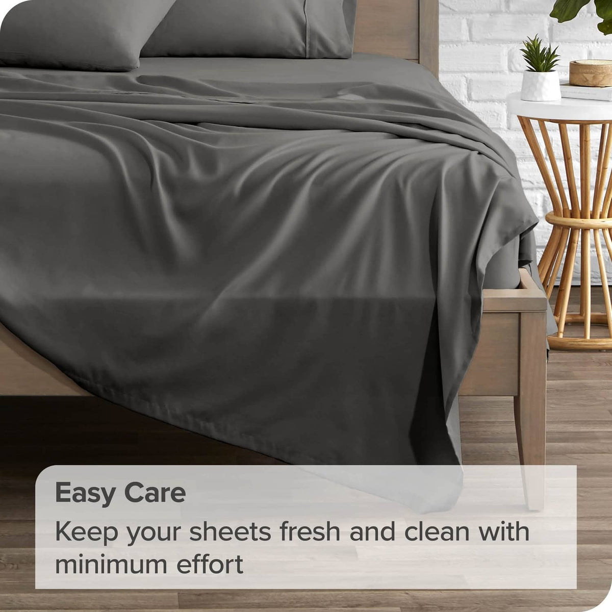 Grey flat sheet set draped on a bed with soft, wrinkle-free fabric