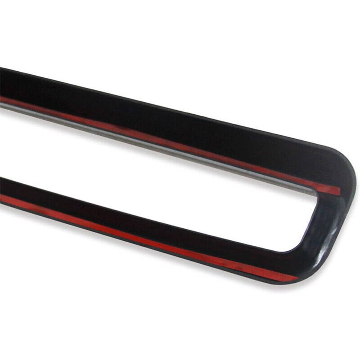 Close-up of black grille trim with red accent stripe inside the rectangular opening