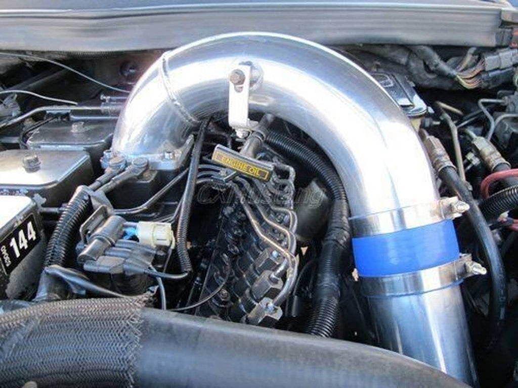 Stainless intake elbow and blue silicone coupler installed in engine bay