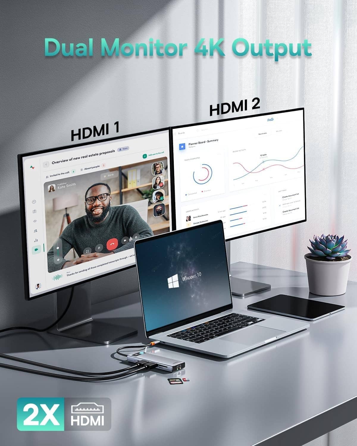 Grey dual-monitor HDMI USB-C hub connected to laptop, blue indicator and cables