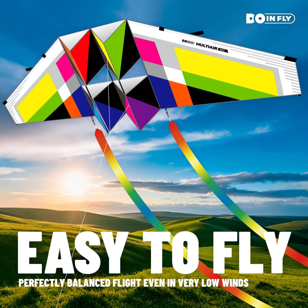 Triangular-shaped multicolor kite with geometric panels and colorful ribbon tail streamers