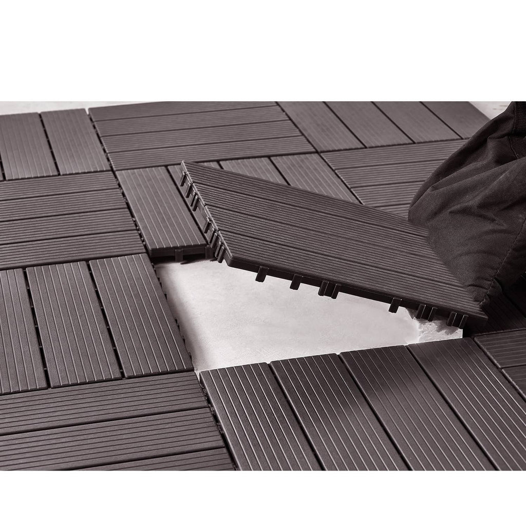 Interlocking deck tiles in dark gray, ribbed boards with raised locking tabs
