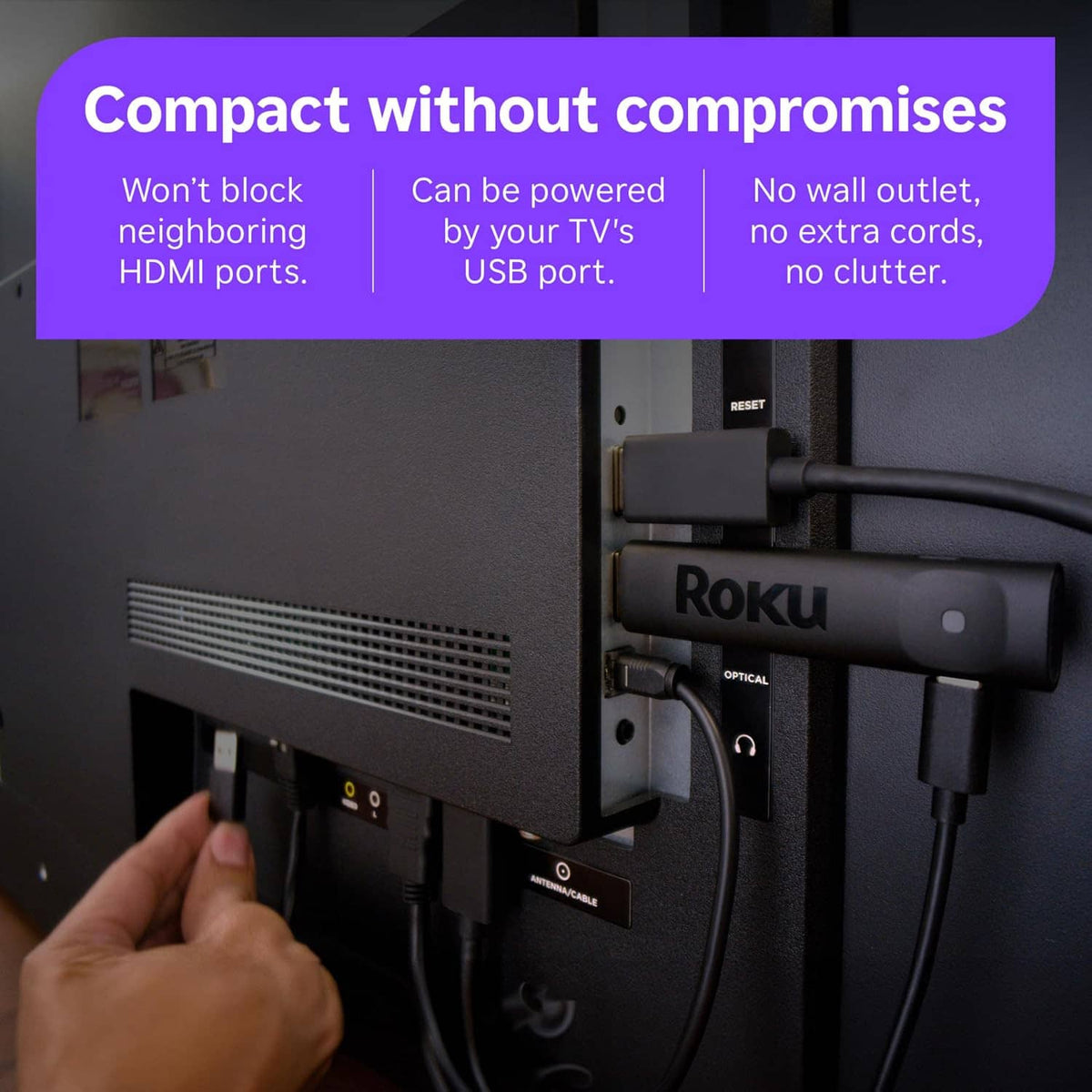 Roku streaming stick connected to TV HDMI port with optical cable and power