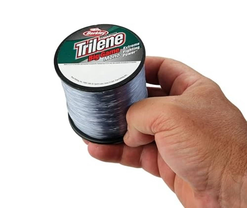 Berkley Trilene Big Game monofilament line spool held in hand, steel blue