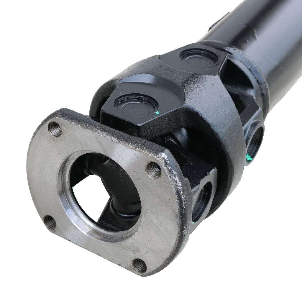 Close-up of rear driveshaft yoke and mounting flange, dark housing with silver ring