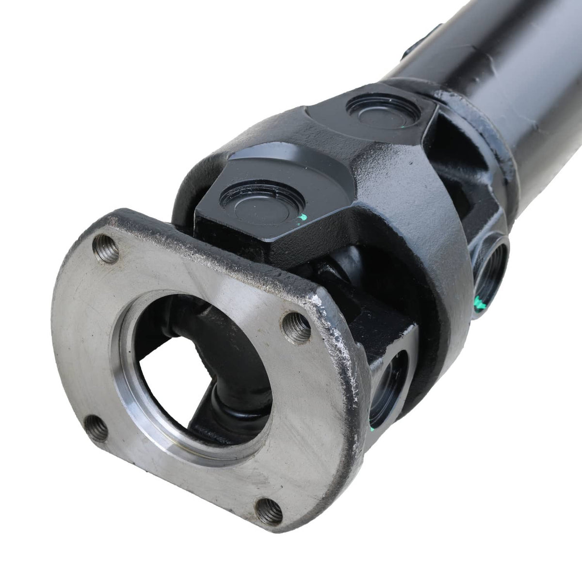 Close-up of rear driveshaft yoke and mounting flange, dark housing with silver ring
