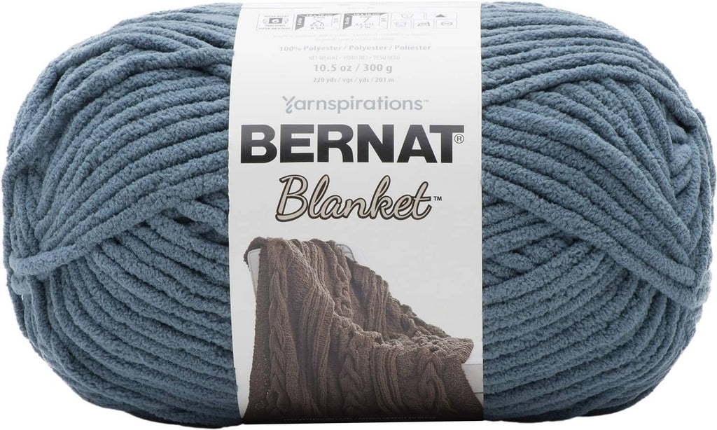 Bernat super bulky yarn skein in stormy blue-green, with brand label on center band