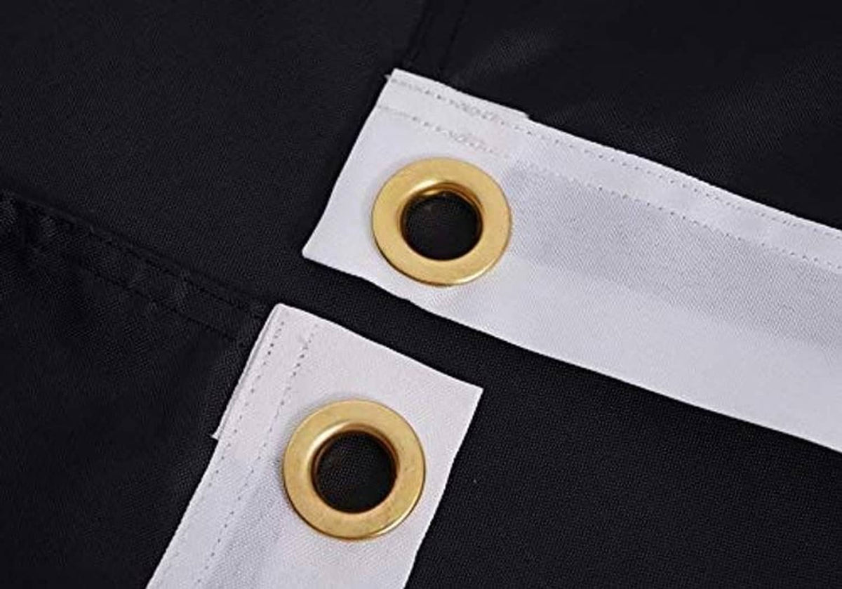 Black outdoor flag header with reinforced stitching and brass-tone grommets