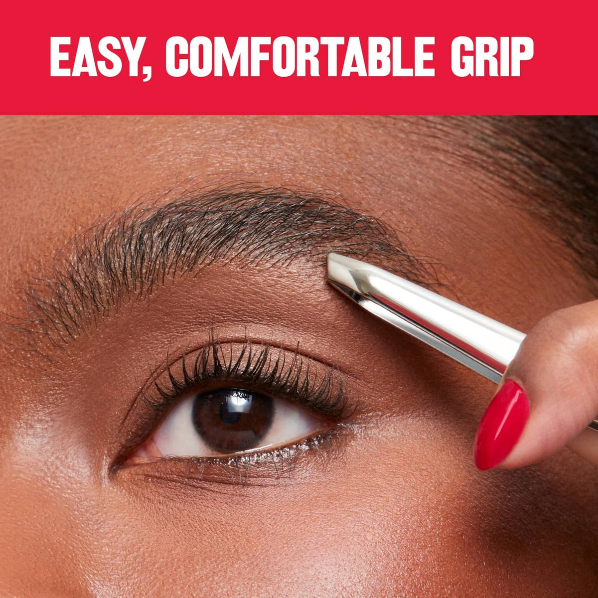 Revlon slant tweezer with red grip tip, holding above an eyebrow area