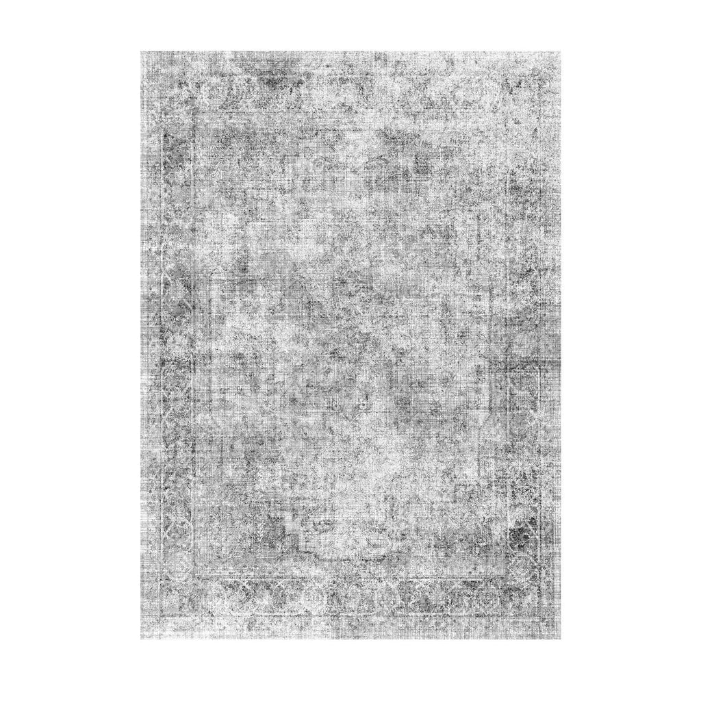 Gray abstract area rug with distressed, mottled pattern and flat laid surface