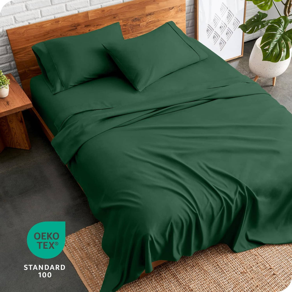 Forest green bed linen set made up on bed with two pillowcases