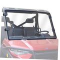 Front UTV windshield with dark frame and clear shield, mounted on vehicle
