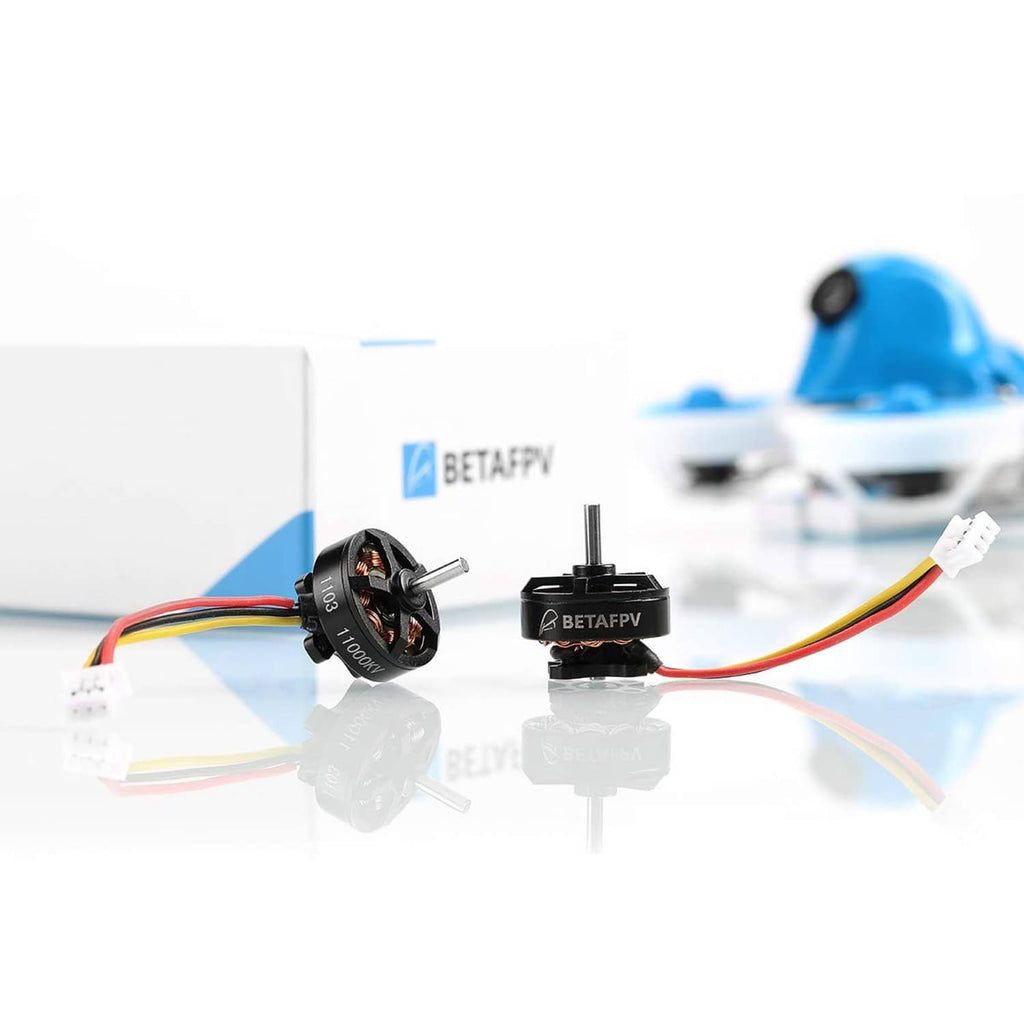 Two black 1103 brushless FPV motors with colored leads on a table