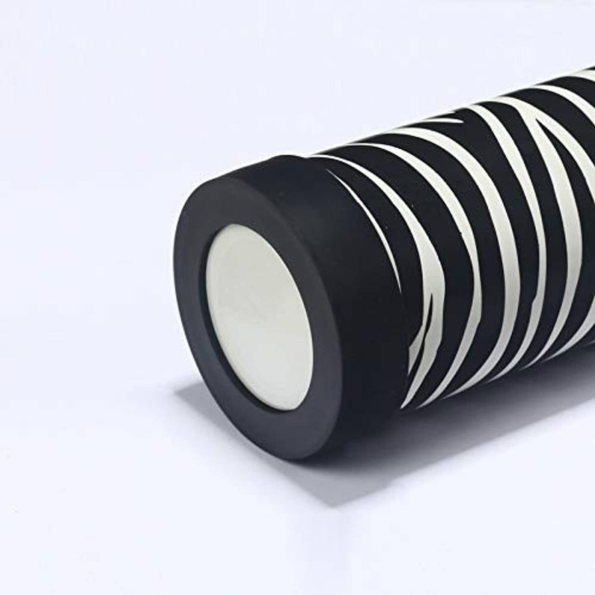 Black silicone bottle base sleeve, close-up of round ring with ribbed outer edge