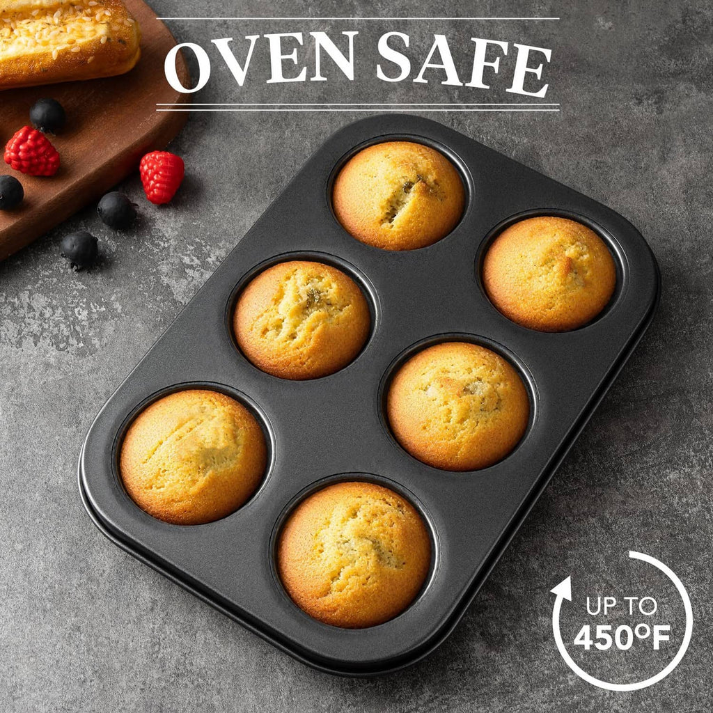 Mini fluted tube cake pan with six golden cakes, dark nonstick mold surface