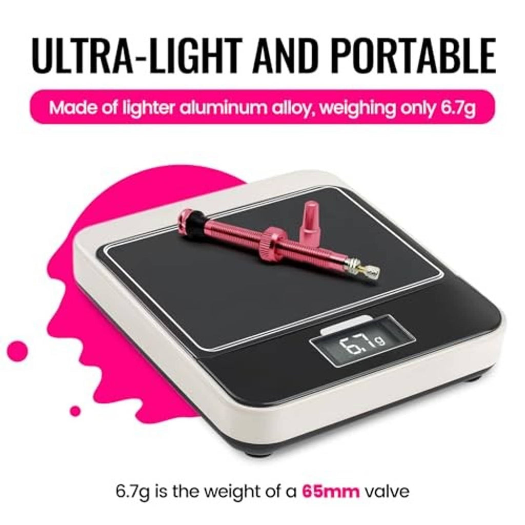 Ultra-light pink tubeless Presta valve stem on digital scale