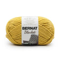 Bernat Blanket yarn skein in mustard yellow with product label
