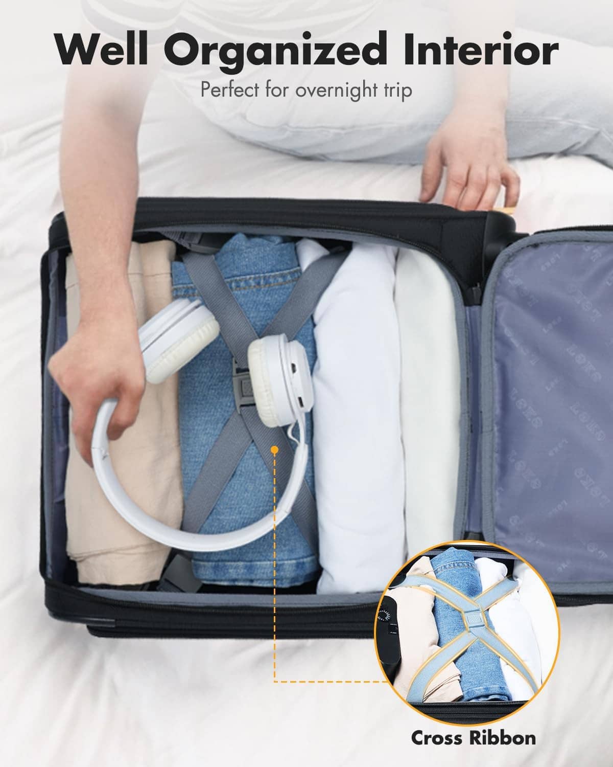 Black softside suitcase interior with cross-ribbon straps and organized compartments