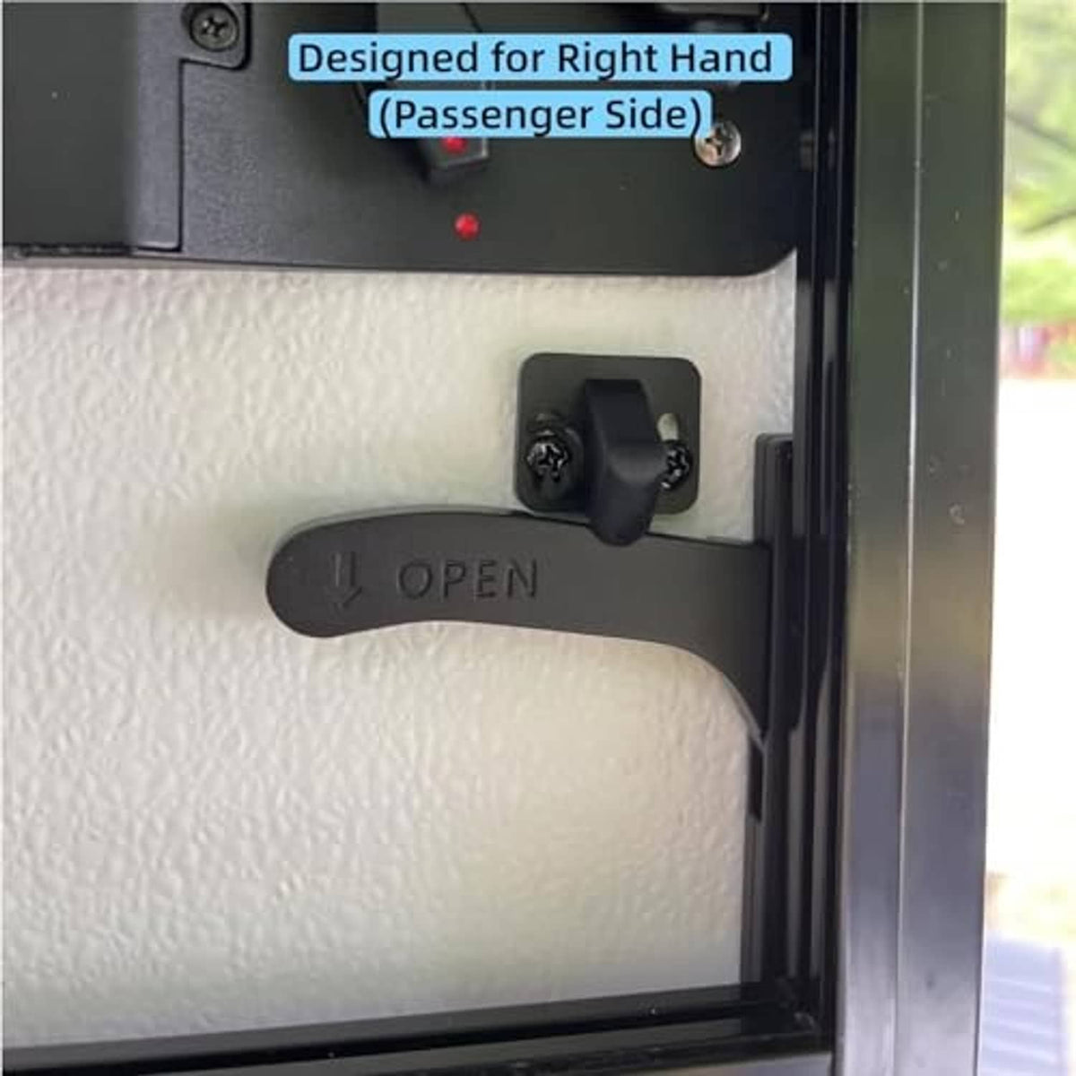 Right-hand RV screen door latch handle mounted on a dark door panel with OPEN lever