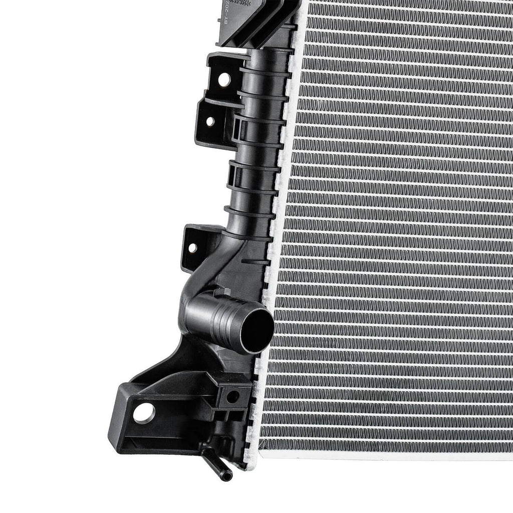 Automotive radiator side detail with black hoses, connectors, and silver fin core