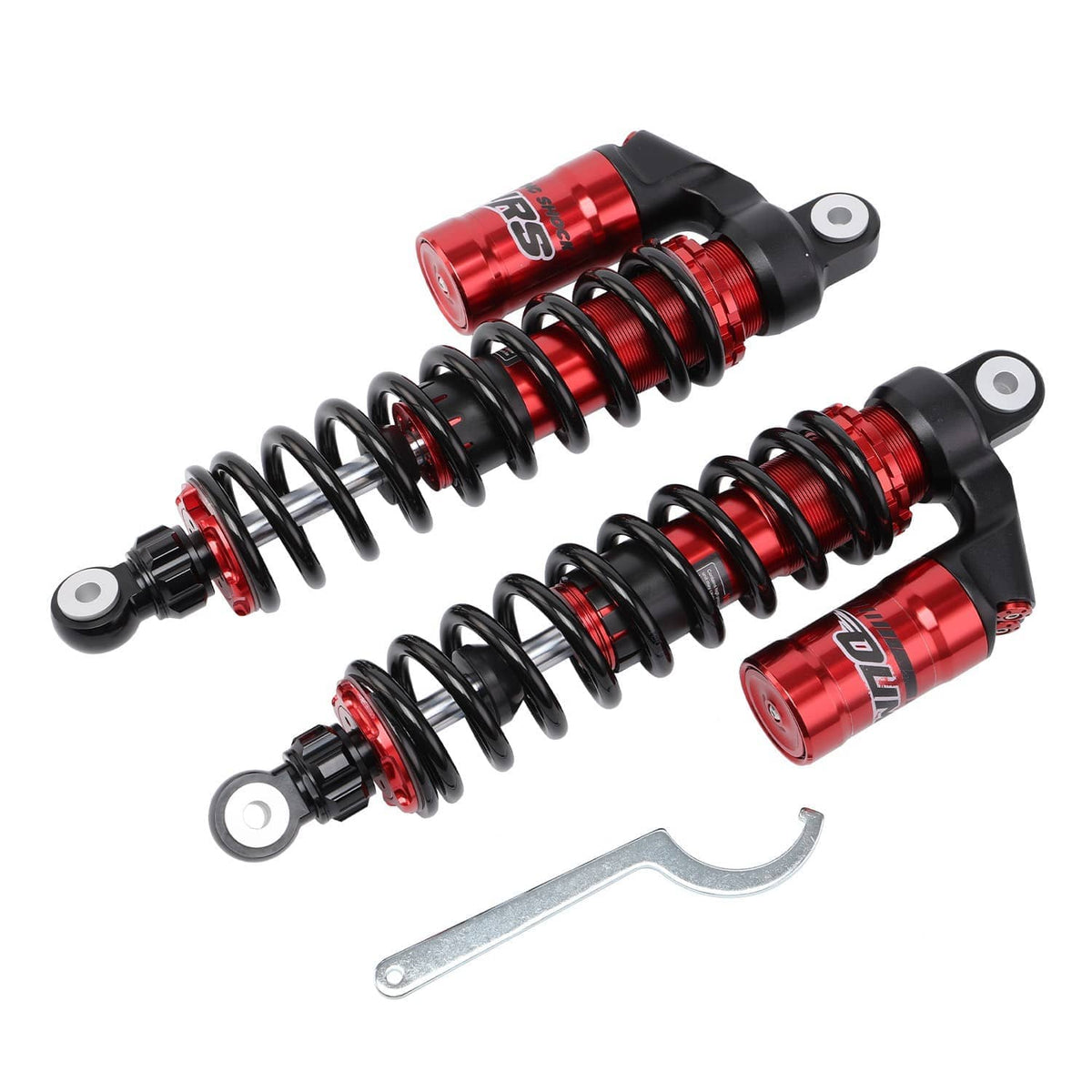 Front shock absorbers with red reservoirs and black coil springs, plus wrench