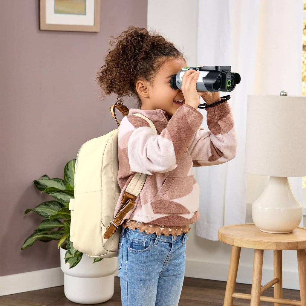 Child looking through binoculars with built-in color screen display