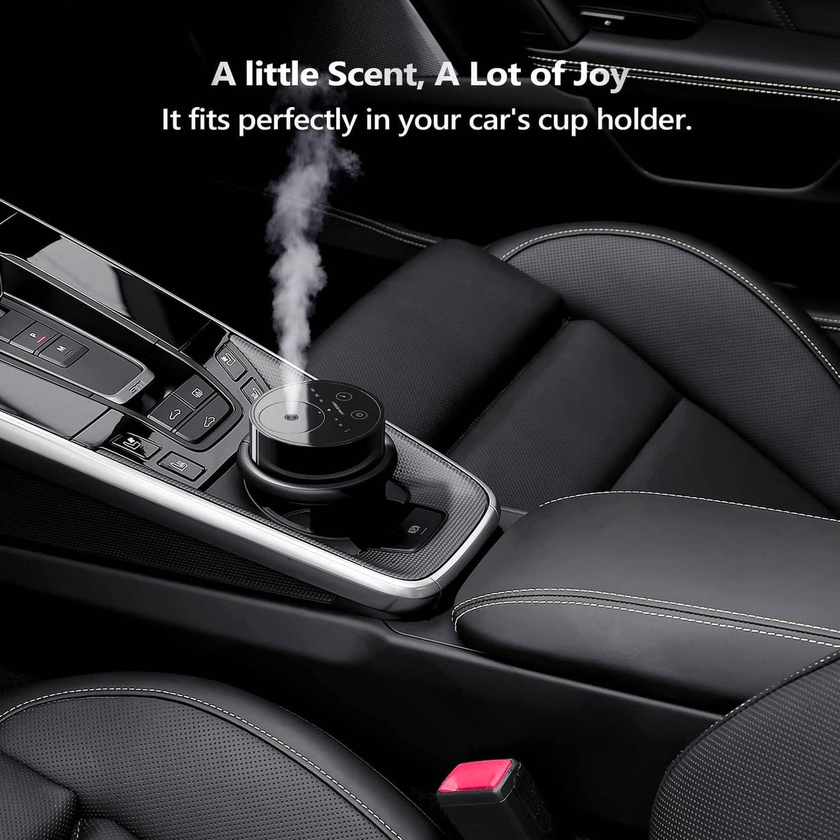 Black waterless essential oil diffuser in car cup holder emitting mist