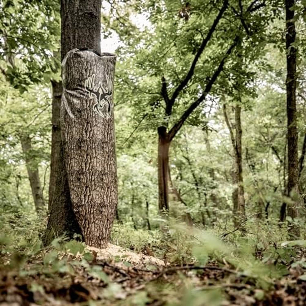 Tree-bark camo gravity feeder bag hanging on a tree