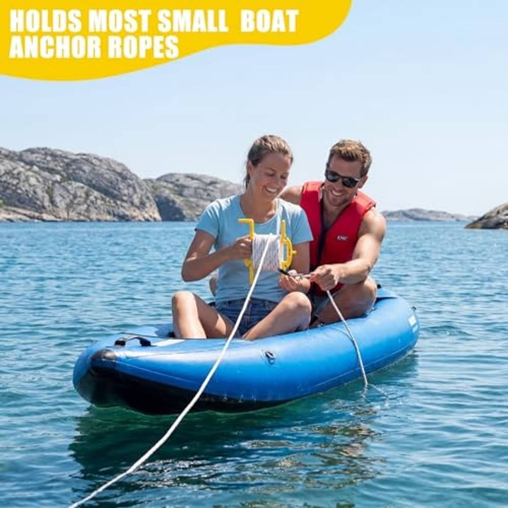 Boat user holding a large anchor rope winder with wrapped white rope coil and yellow handles.