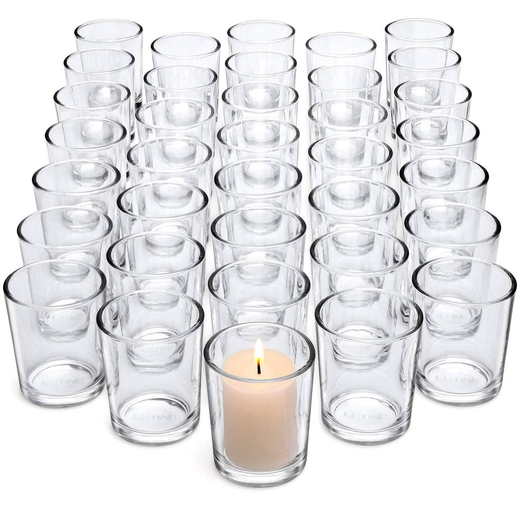 36 clear glass tea light votive holders, empty cups arranged in rows