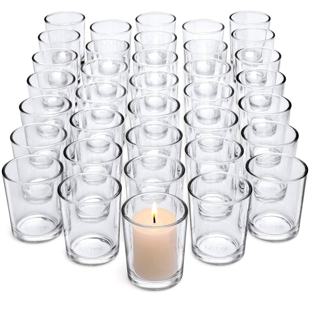 36 clear glass tea light votive holders, empty cups arranged in rows