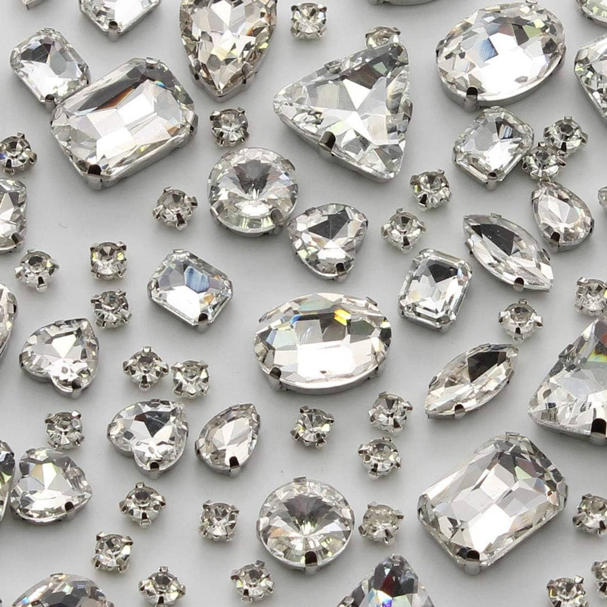 Mixed-shape crystal glass sew-on rhinestones, clear facets with silver-toned settings