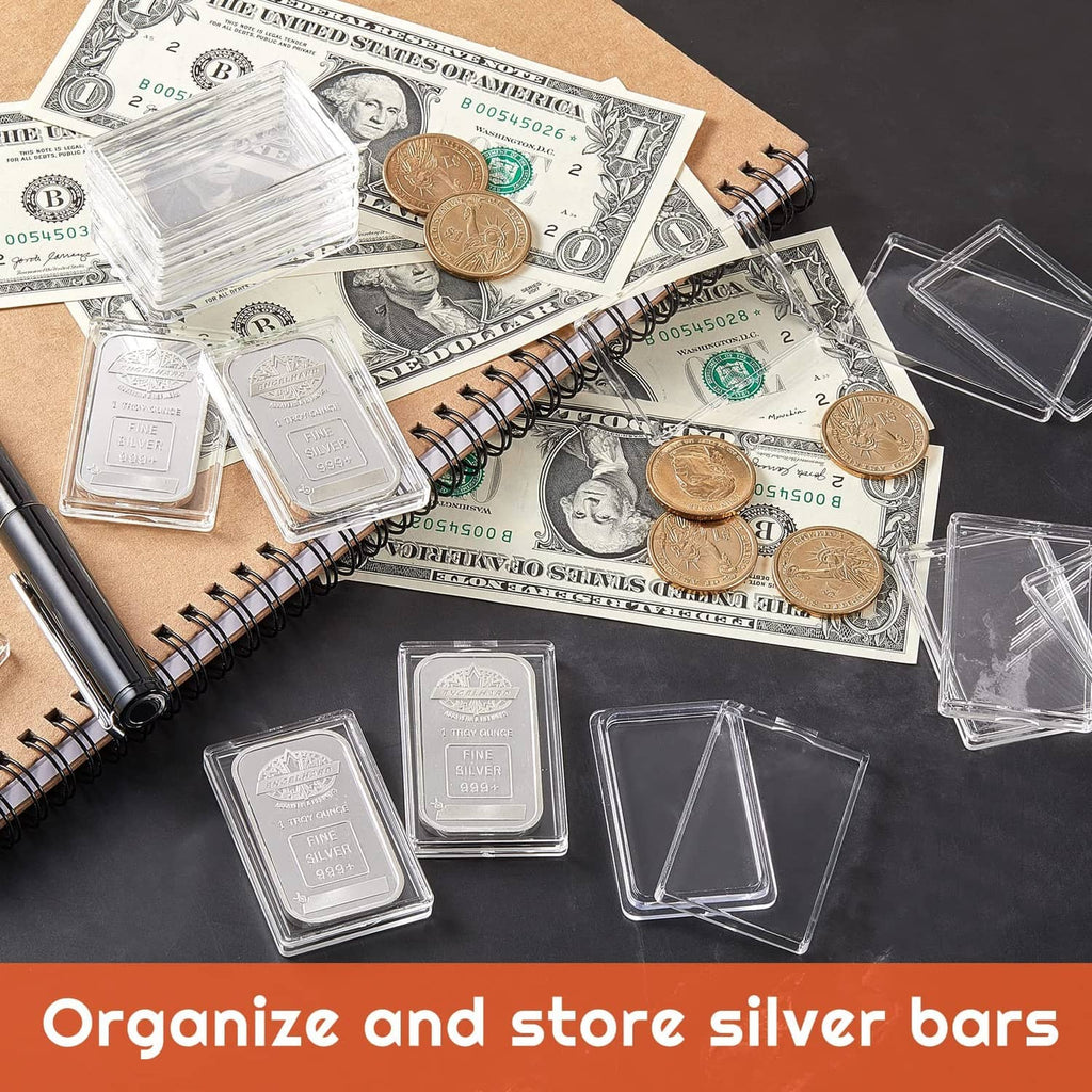 Clear acrylic silver bar holders displayed with coins and stacked cases