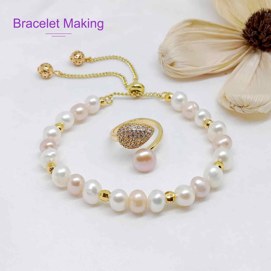 Brown elastic string bracelet with white pearl beads and gold clasp detail