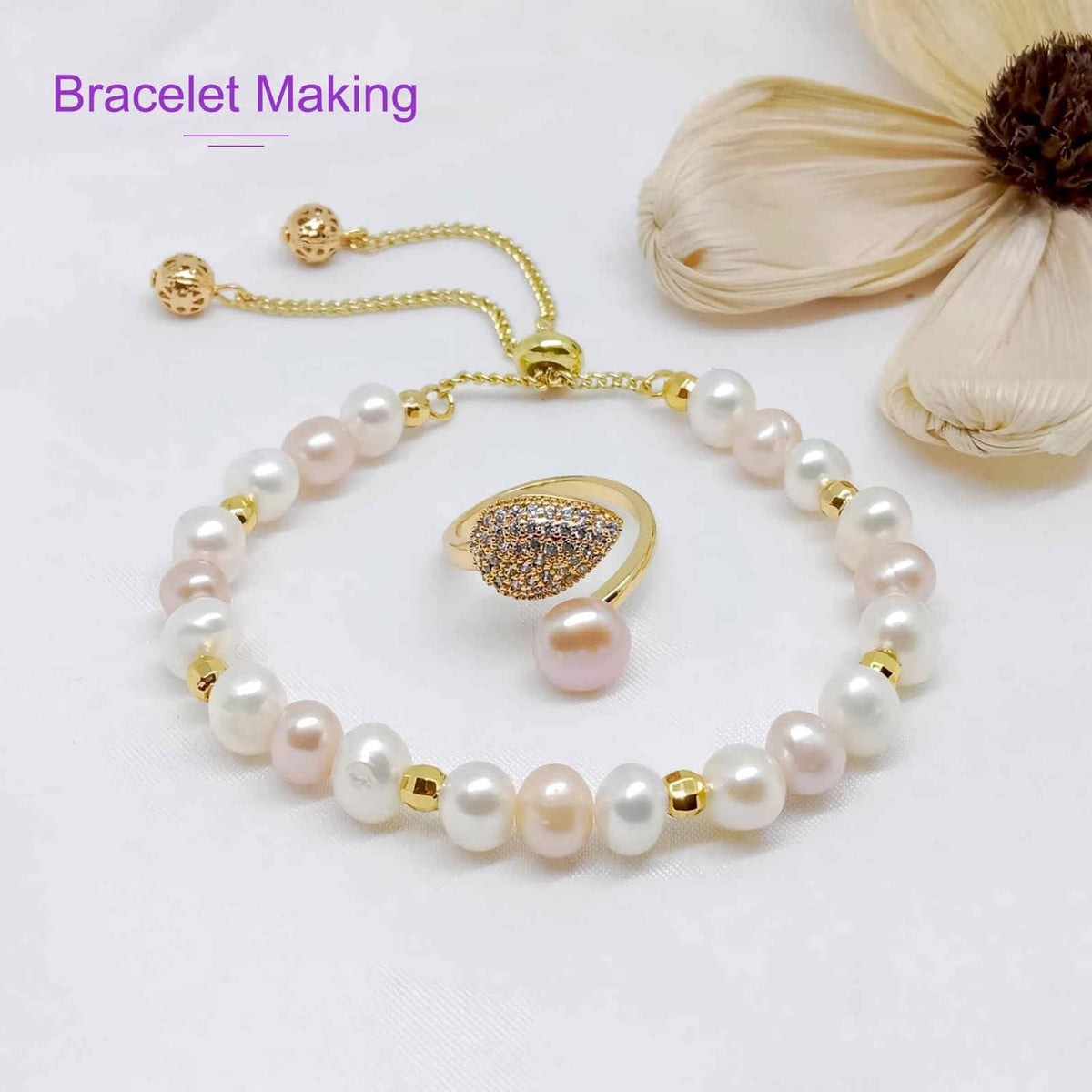 Brown elastic string bracelet with white pearl beads and gold clasp detail