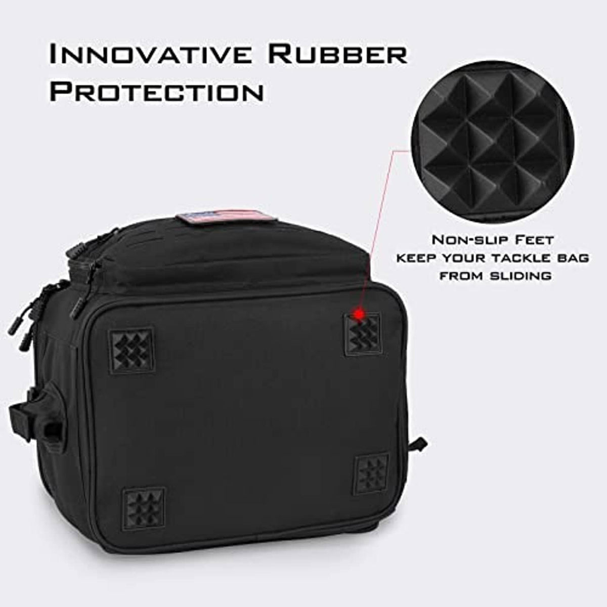 Black tackle bag with textured non-slip feet and zippered front panel, compact rectangular design.