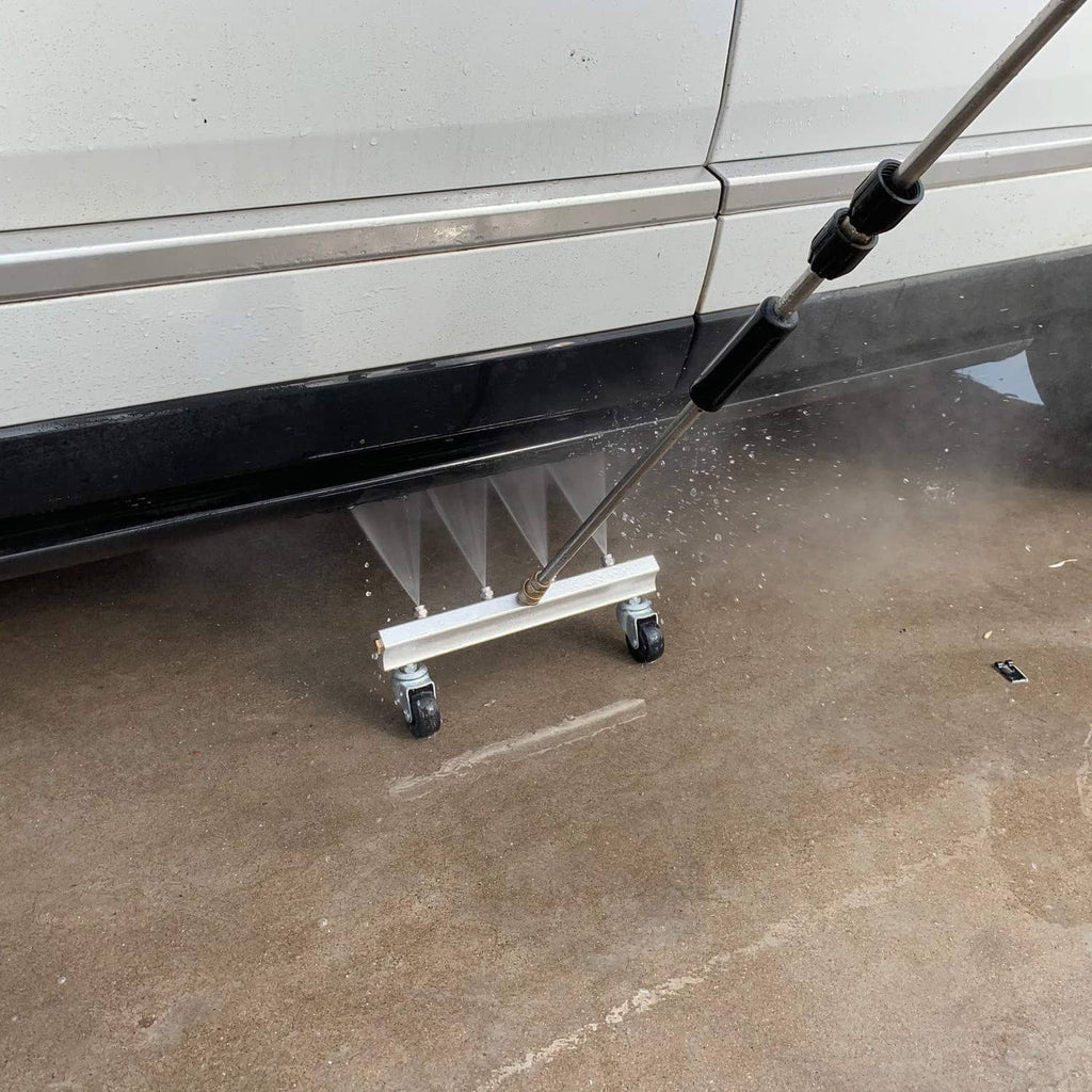 Undercarriage cleaner frame with four caster wheels and wand connected to central inlet
