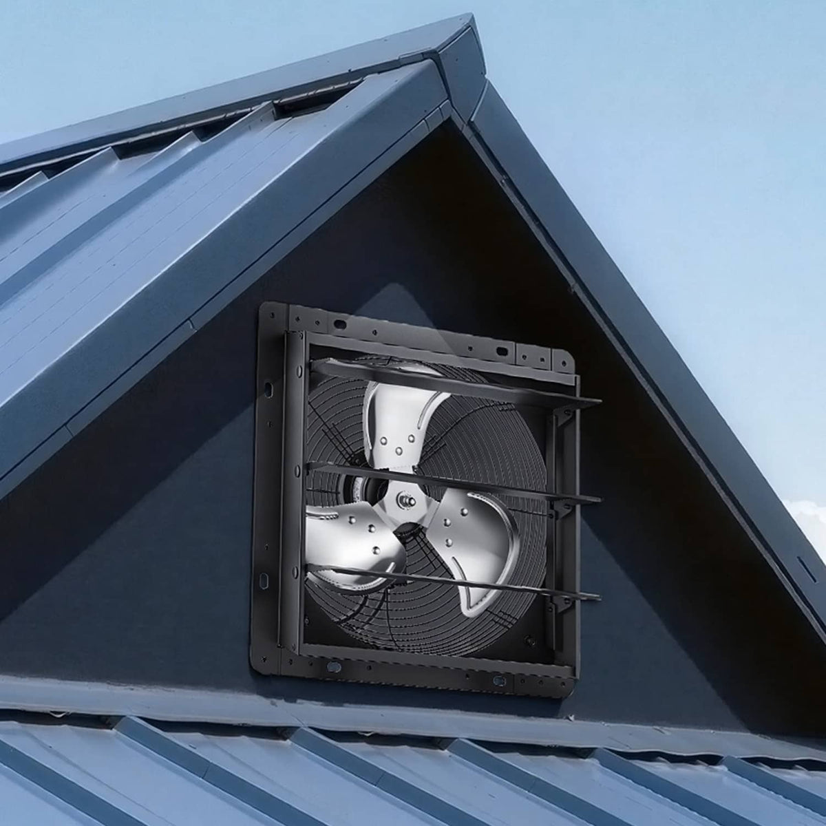 Wall-mounted shutter exhaust fan installed in an eave with louvered grille