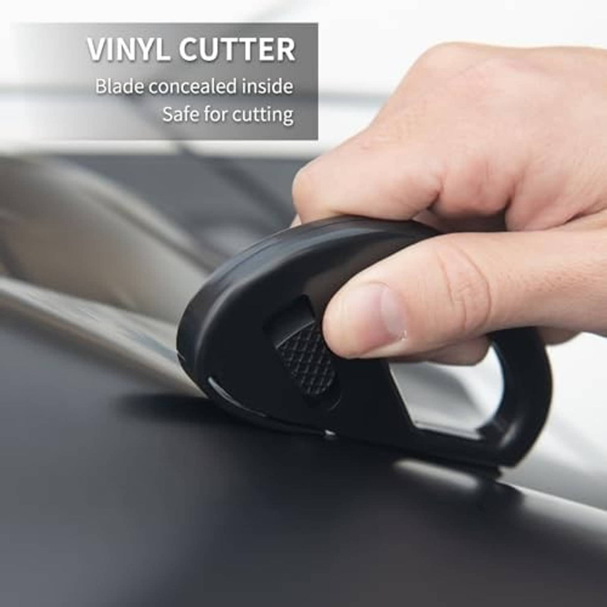 Black vinyl cutter tool with concealed blade for cutting window tint film