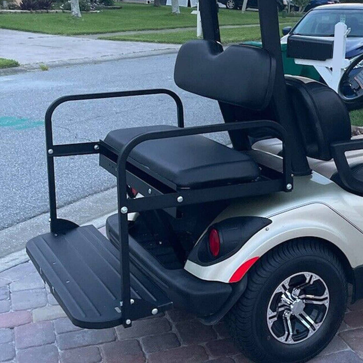 Rear seat kit on golf cart with black armrests and dark gray seat and back cushions