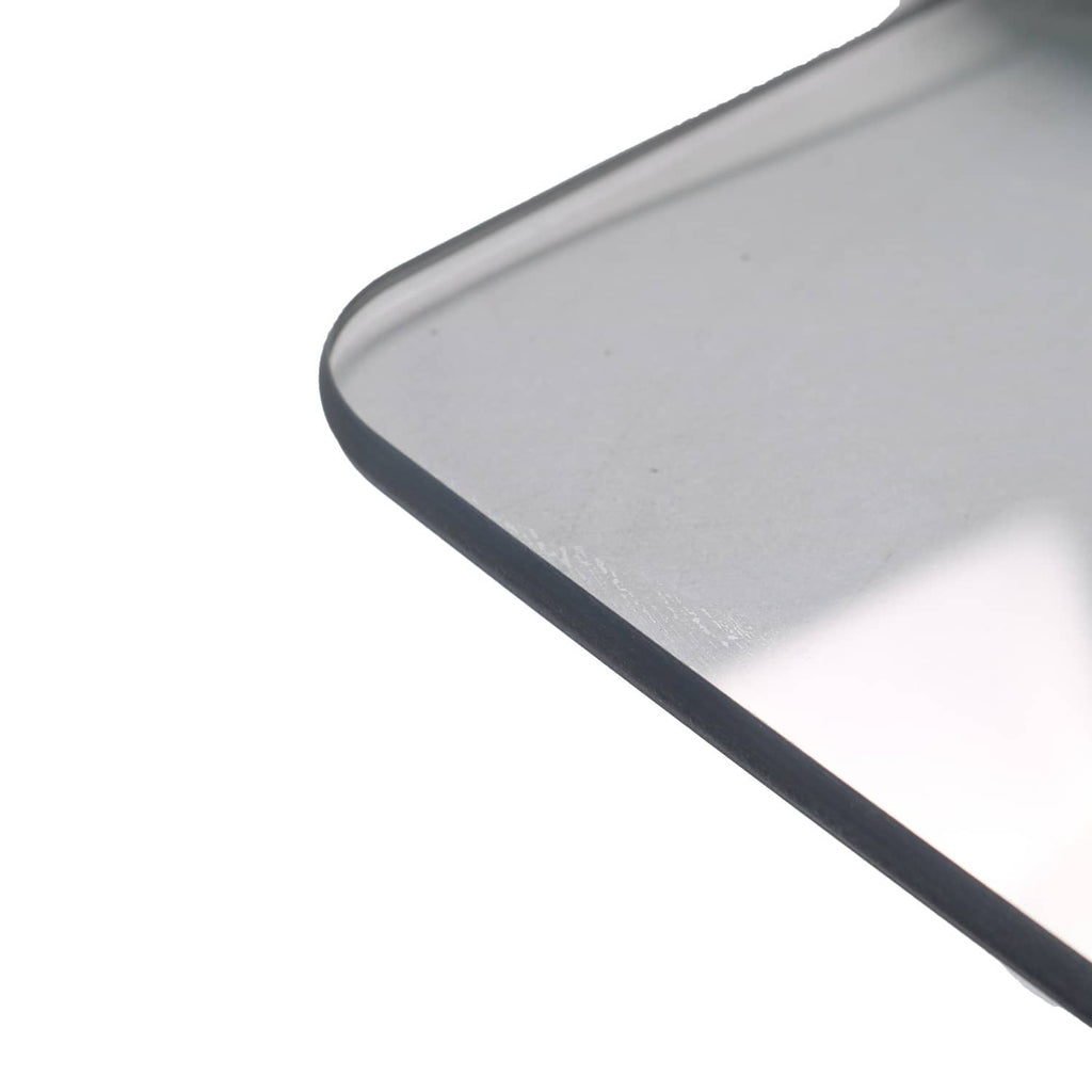Front windshield panel corner with dark trim along rounded edge, clear tinted plastic.